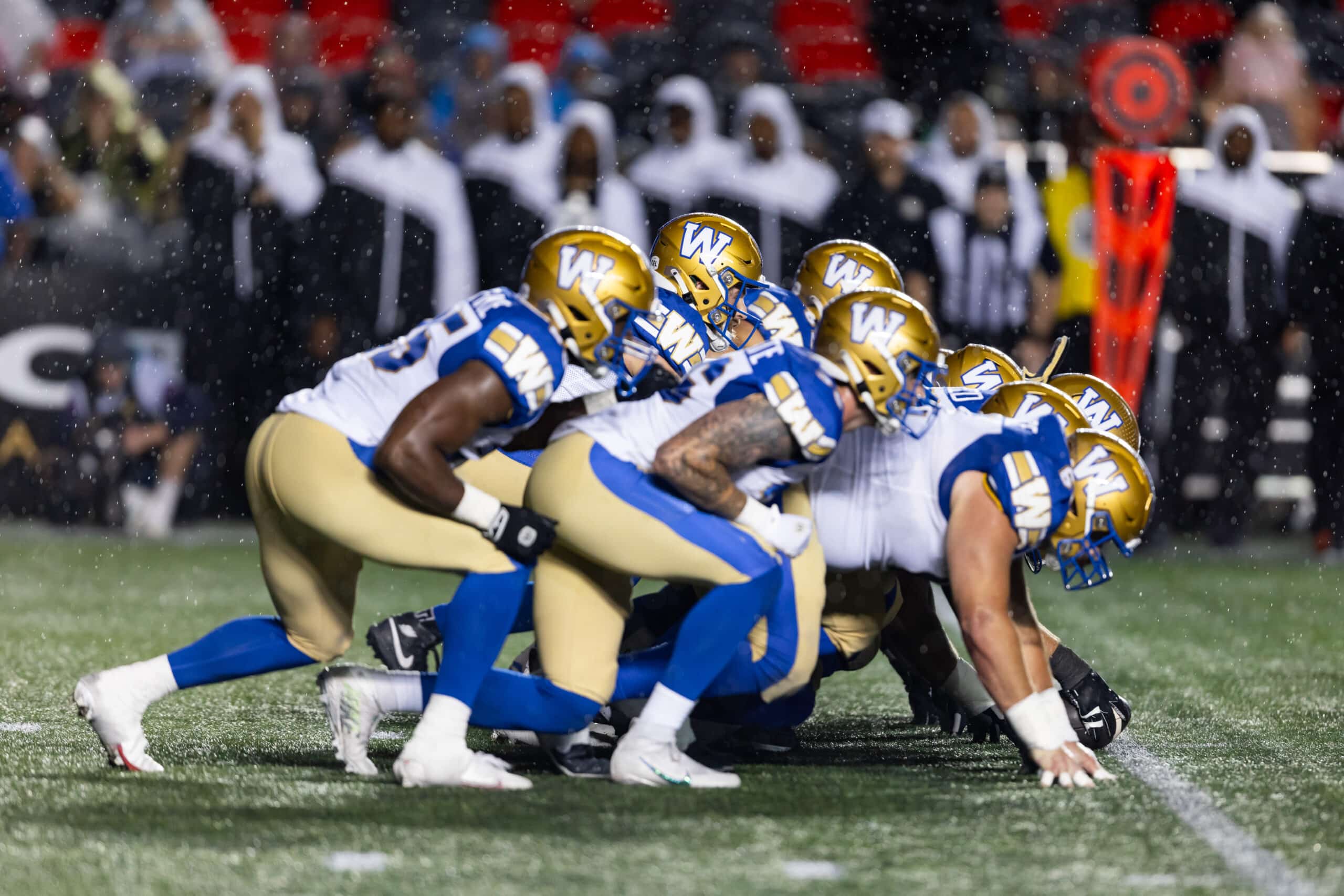 JUNE 13: Winnipeg Blue Bombers quarterback Chris Streveler (17) lines up behind the offensive line for a quarterback sneak during Canadian Football League action between the Winnipeg Blue Bombers and Ottawa Redblacks on June 13, 2024, at TD Place at Lansdowne Park in Ottawa, ON, Canada. You can bet on the Blue Bombers through Manitoba sports betting sites. (Photo by Richard A. Whittaker/Icon Sportswire via Getty Images)