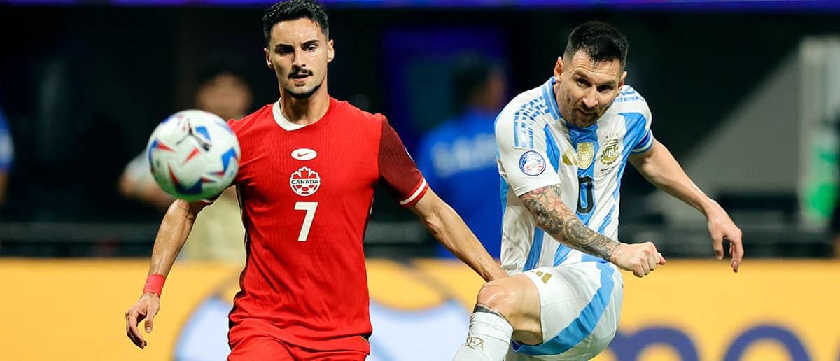 Stephen Eustaquio of Canada battles for possession with Lionel Messi of Argentina during the CONMEBOL Copa America group A match between Argentina and Canada at Mercedes-Benz Stadium on June 20, 2024 in Atlanta, Georgia