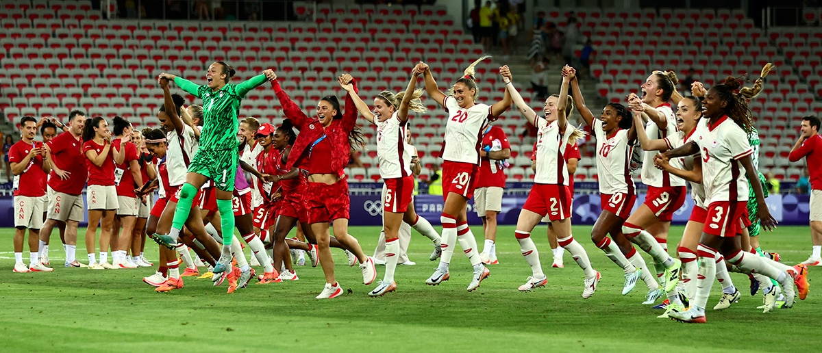 Players of Team Canada celebrate after winning the Women's group A match between Colombia and Canada during the Olympic Games Paris 2024 at Stade de Nice on July 31, 2024 in Nice, France.