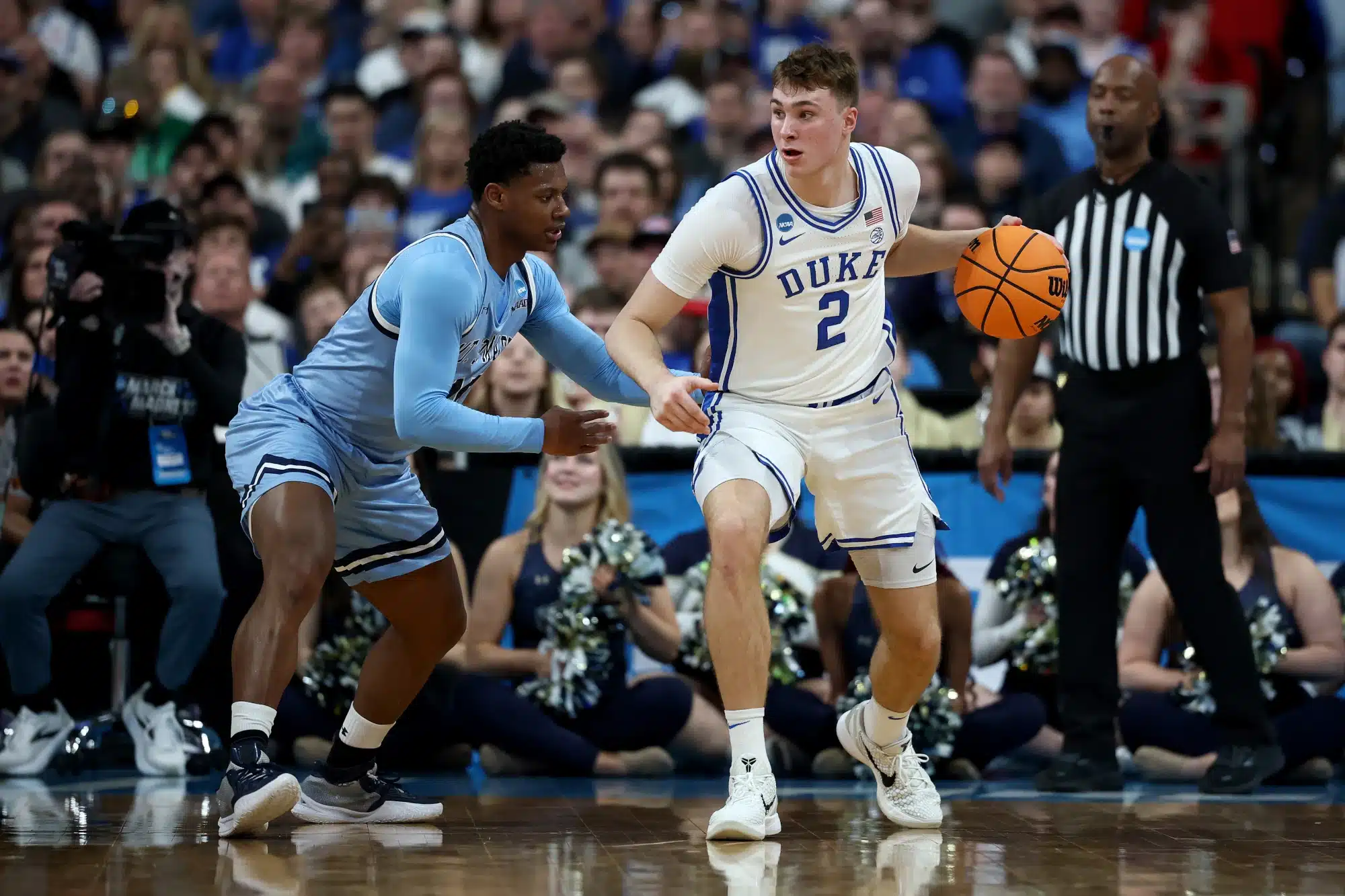 Xavier Lipscomb #45 of the Mount St. Mary's Mountaineers defends Cooper Flagg #2 of the Duke Blue Devils during the first half in the first round of the NCAA Men's Basketball Tournament at Lenovo Center on March 21, 2025 in Raleigh, North Carolina. 