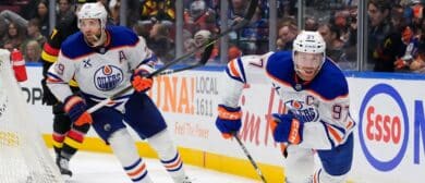 Connor McDavid #97 and Leon Draisaitl #29 of the Edmonton Oilers skate during the third period of their NHL game against the Vancouver Canucks at Rogers Arena on January 18, 2025 in Vancouver, British Columbia, Canada