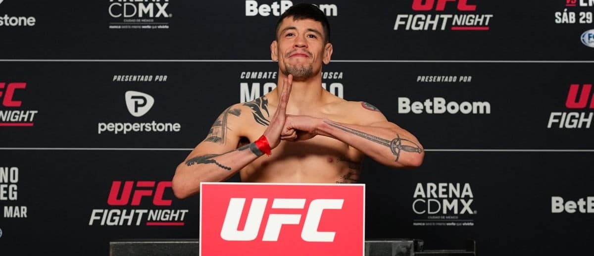 Brandon Moreno of Mexico poses on the scale during the UFC Fight Night official weigh-in at the InterContinental Mexico City on March 28, 2025 in Mexico City, Mexico.