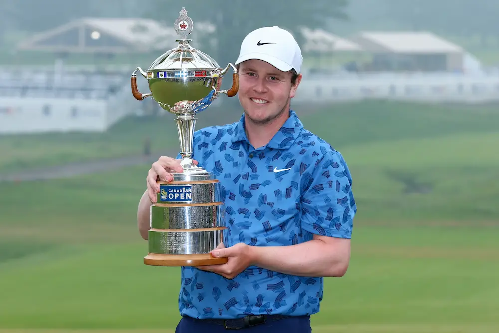 Robert MacIntyre of Scotland celebrates with the trophy after winning the final round of the RBC Canadian Open at Hamilton Golf & Country Club on June 02, 2024 in Hamilton, Ontario, Canada. 
