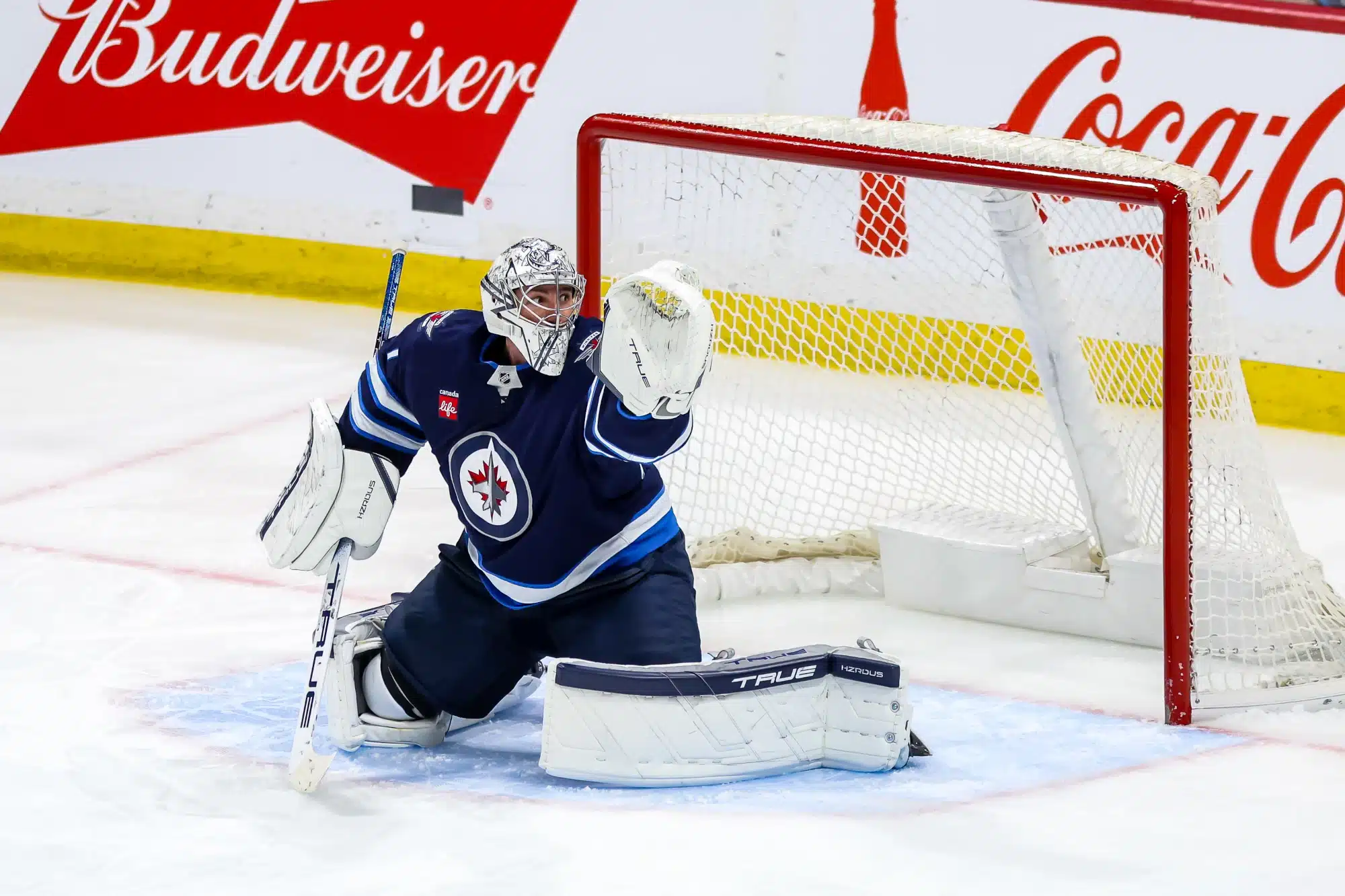 Goaltender Connor Hellebuyck #37 of the Winnipeg Jets guards the net as he keeps an eye on the play during third period action against the Dallas Stars at the Canada Life Centre on March 14, 2025 in Winnipeg, Manitoba, Canada. 