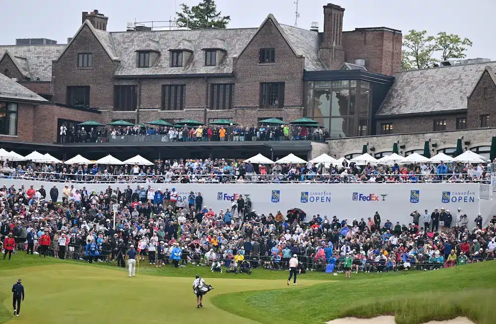 Tom Kim of South Korea and Rory McIlroy of Northern Ireland walk onto the 18th green during the final round of the RBC Canadian Open at Hamilton Golf & Country Club on June 02, 2024 in Hamilton, Ontario, Canada. 