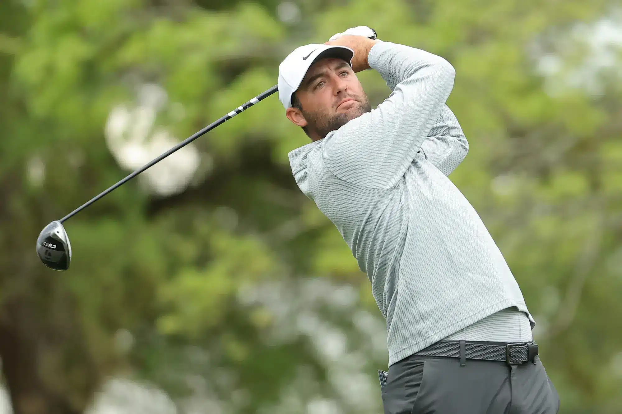 Scottie Scheffler of the United States hits his tee shot on the 12th hole during the second round of the Texas Children's Houston Open 2025 at Memorial Park Golf Course on March 28, 2025 in Houston, Texas. Scottie leads with the best 2025 Masters Betting Odds.