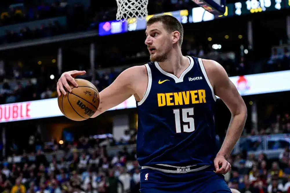 Nikola Jokic #15 of the Denver Nuggets collects a loose ball in the second half against the Utah Jazz at Ball Arena on March 28, 2025 in Denver, Colorado.