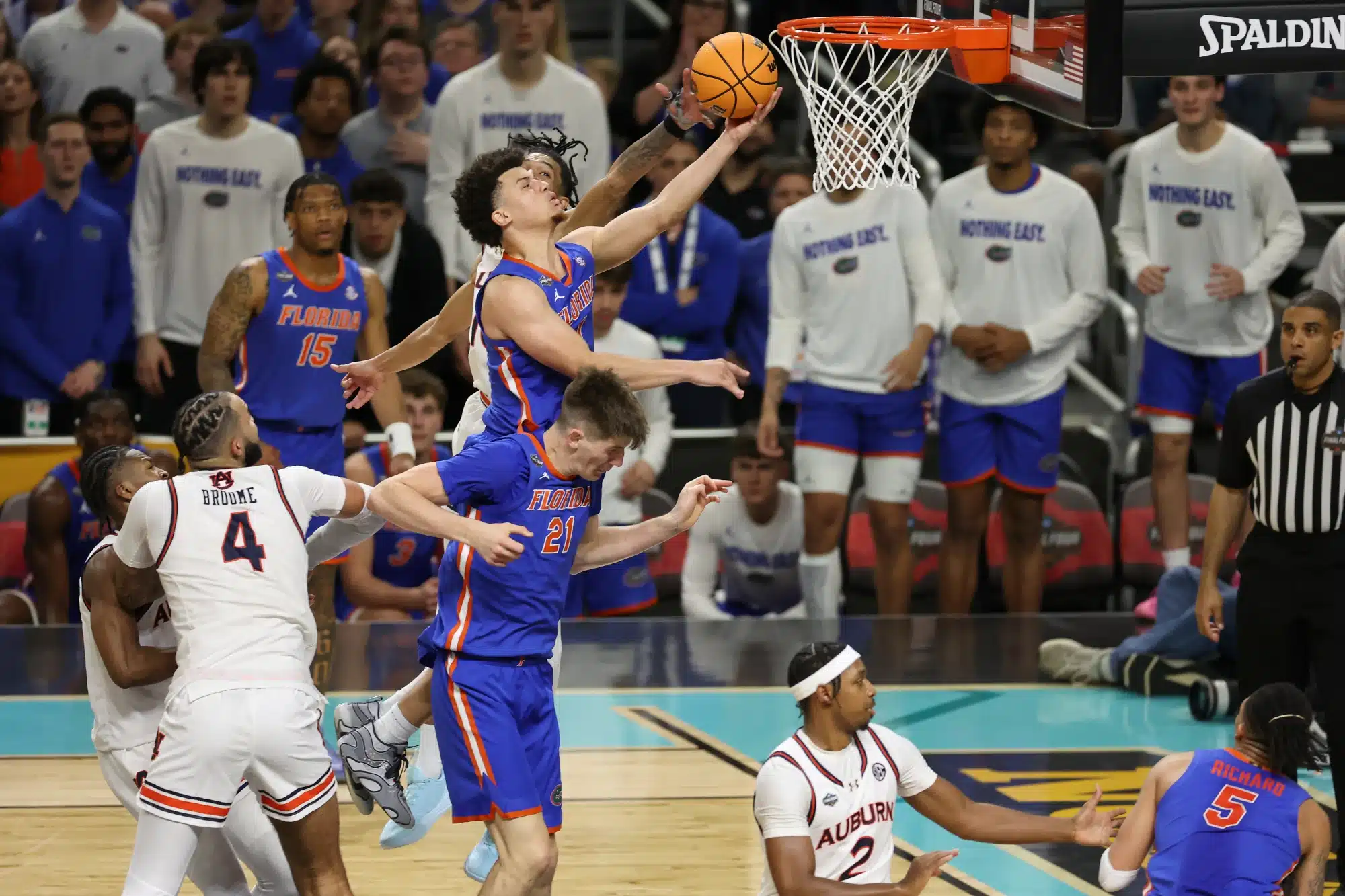 Walter Clayton Jr. #1 of the Florida Gators shoots a layup against the Auburn Tigers defense during the second half in the Final Four game of the NCAA Men's Basketball Tournament at the Alamodome on April 05, 2025 in San Antonio, Texas.