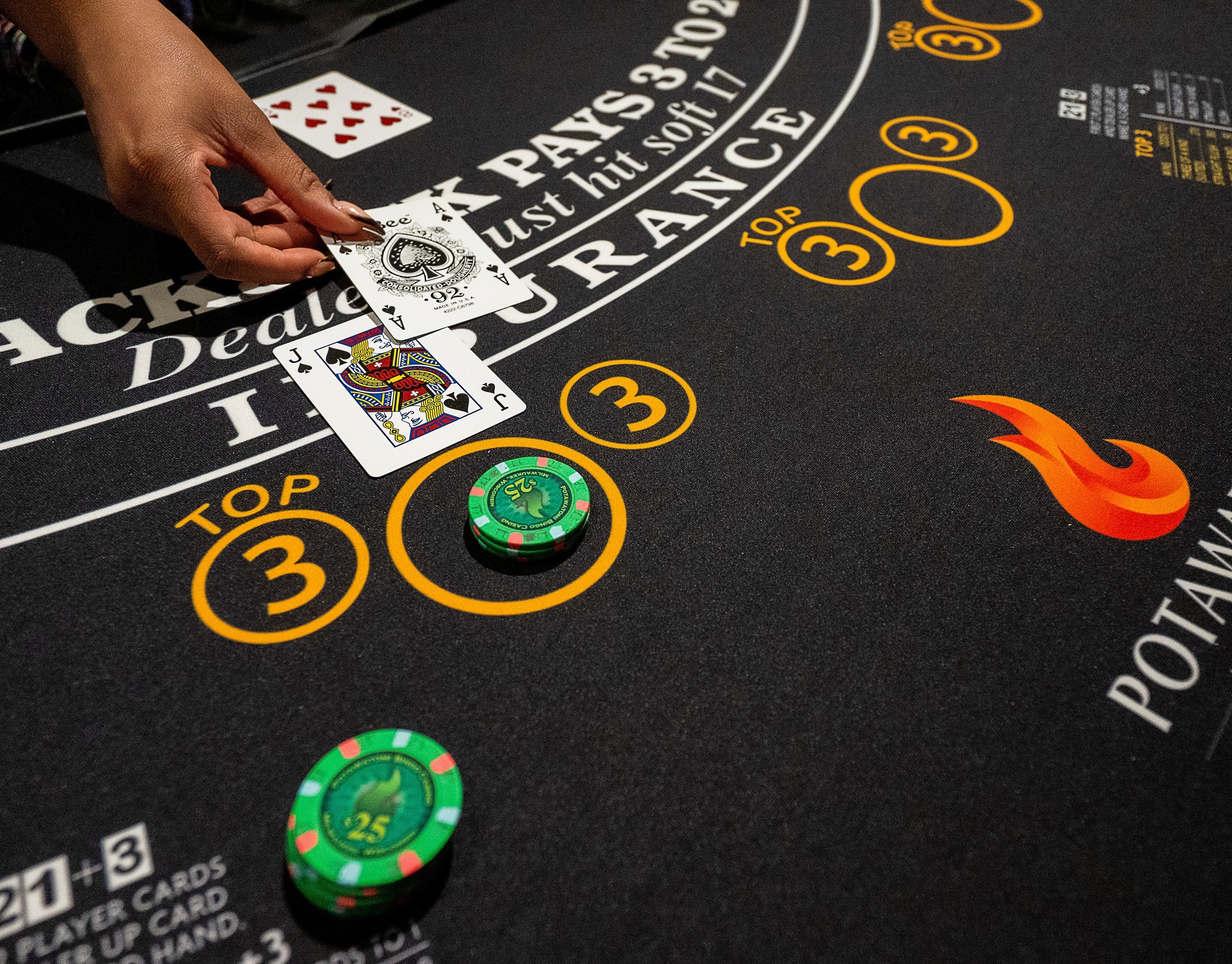 Table games dealer Uquasia Earth places cards on one of the new blackjack tables in the 1833 Club, part of Potawatomi Casino Hotel’s latest round of renovations, which includes new gaming areas, bars and restaurants, located on the third floor on Thursday September 7, 2023 in Milwaukee, Wis.