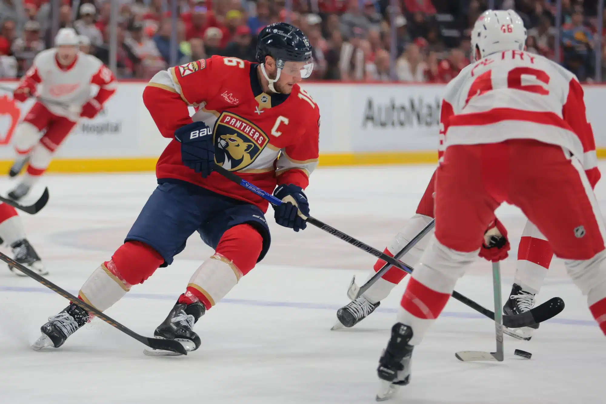 Florida Panthers center Aleksander Barkov (16) Apr 10, 2025; Sunrise, Florida, USA; Florida Panthers center Aleksander Barkov (16) moves the puck against Detroit Red Wings defenseman Jeff Petry (46) during the first period at Amerant Bank Arena.
