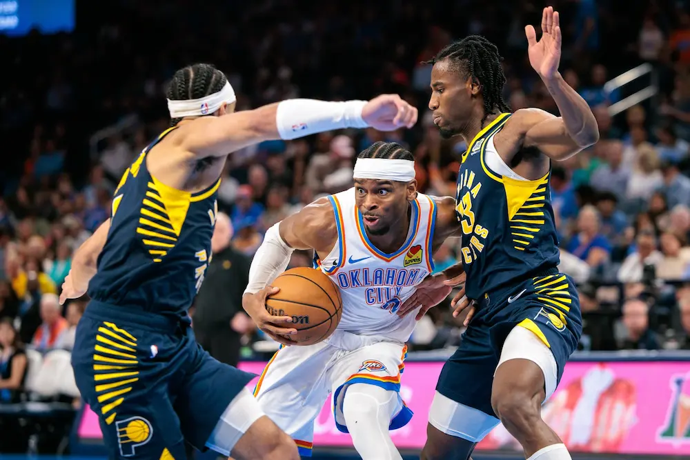 Shai Gilgeous-Alexander #2 of the Oklahoma City Thunder drives to the basket around Myles Turner #33 of the Indiana Pacers during the third quarter Paycom Center on March 29, 2025 in Oklahoma City, Oklahoma.