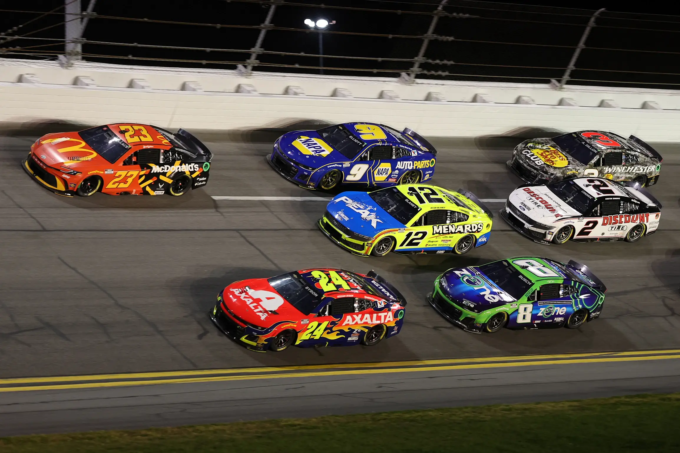 Feb 16, 2025; Daytona Beach, Florida, USA; NASCAR Cup Series drivers and cars race on the track during the Daytona 500 at Daytona International Speedway.