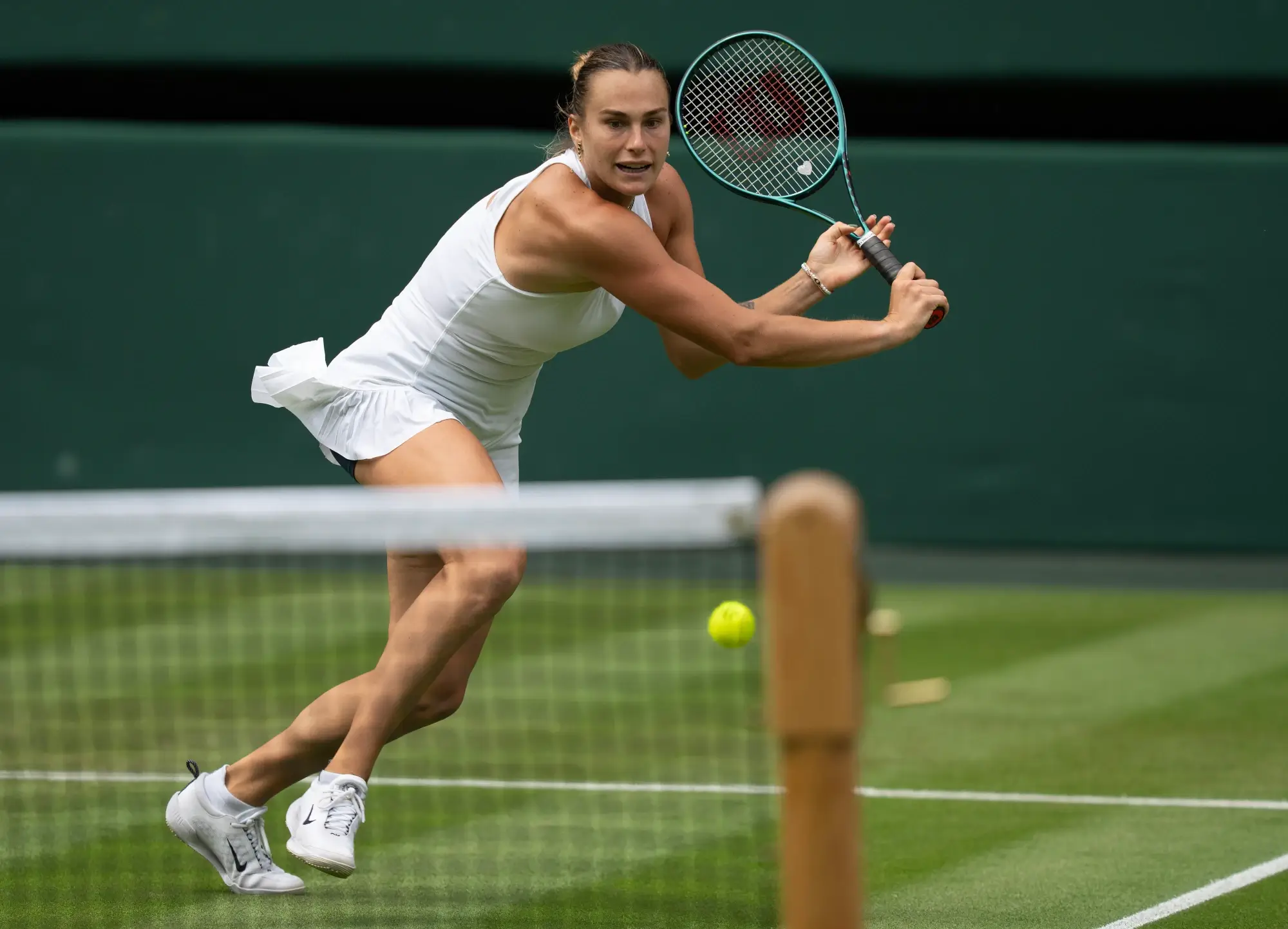 Jul 2, 2025; Wimbledon, United Kingdom; Aryna Sabalenka returns a shot during her match against Marie Bouzkova of the Czech Republic on day three at the All England Lawn Tennis and Croquet Club.