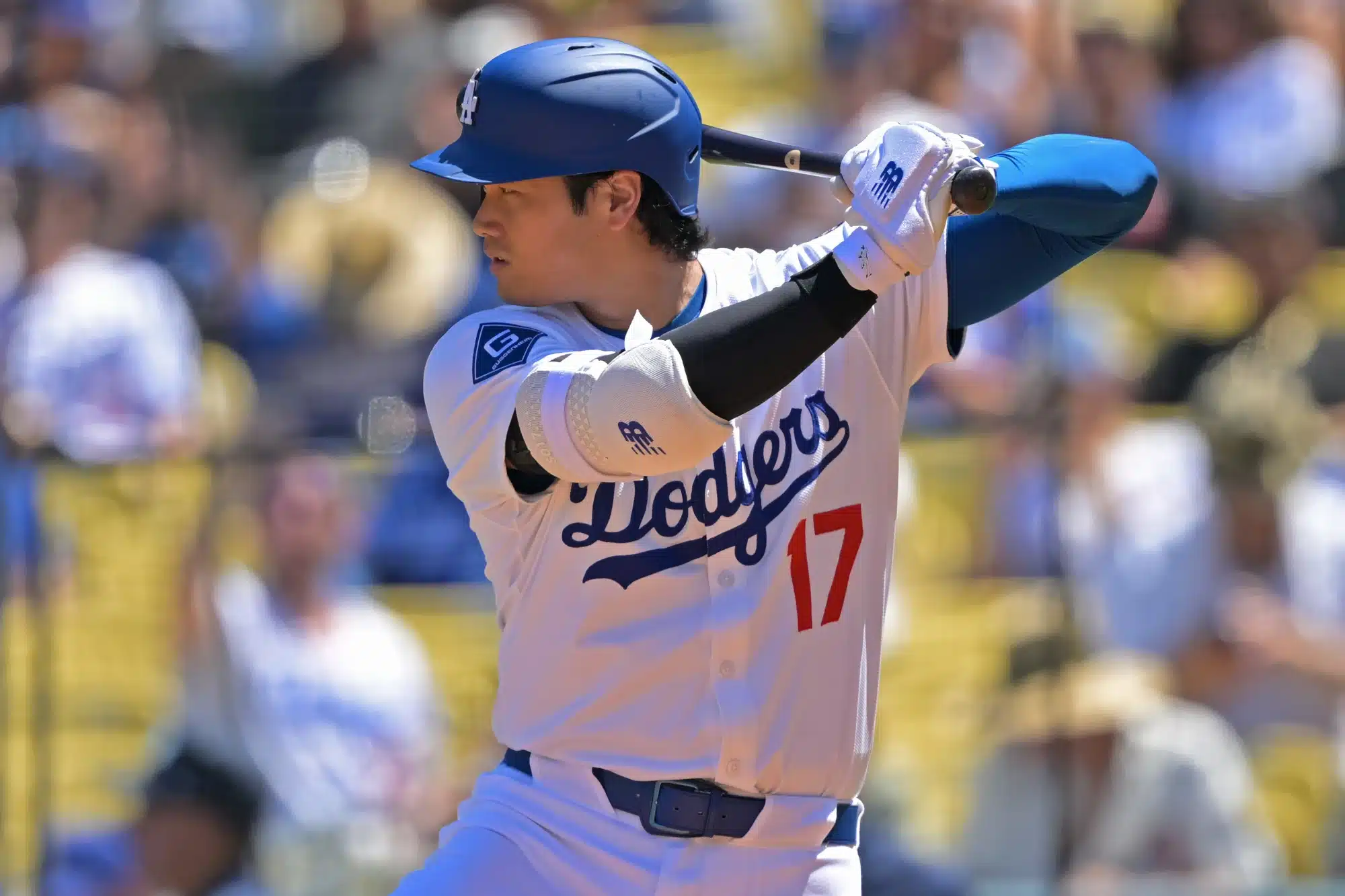 Aug 31, 2025; Los Angeles, California, USA; Los Angeles Dodgers designated hitter Shohei Ohtani (17) singles against the Arizona Diamondbacks at Dodger Stadium. 