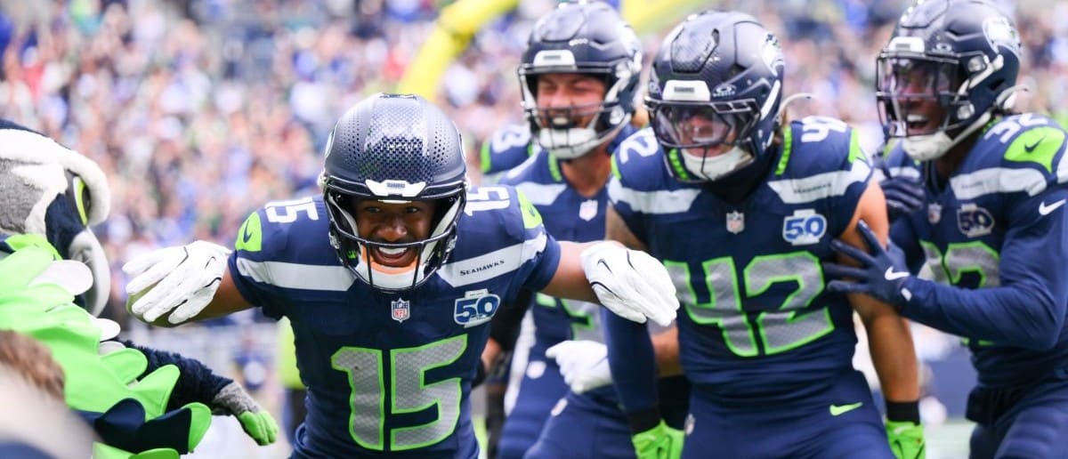 Seattle Seahawks wide receiver Tory Horton (15) celebrates after scoring a 95 yard punt return for a touchdown against the New Orleans Saints during the first quarter at Lumen Field